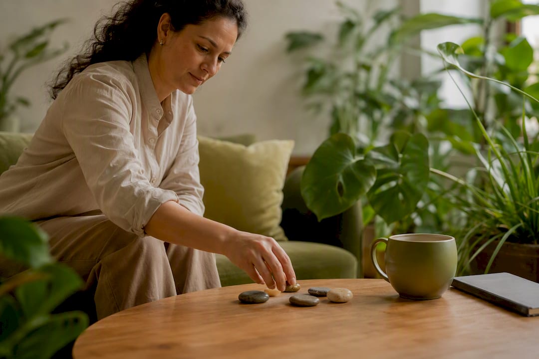 Hands placing stress-relief token on desk